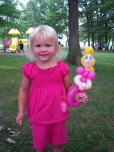 Girl with balloon animal